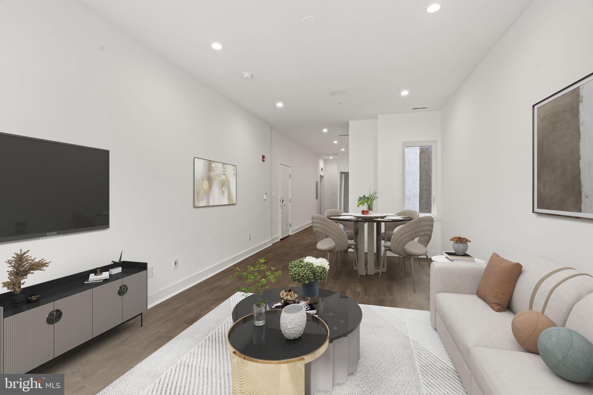 1244 South 20th Street, Unit 2 Philadelphia, PA 19146 - Photo 8 of 30 a living room with furniture and a flat screen tv