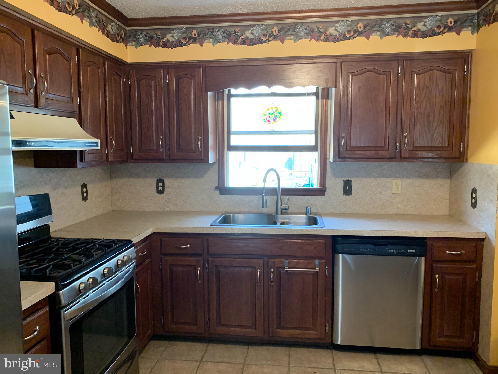 120 Lums Pond Road Bear, DE 19701 - Photo 6 of 28 Large open kitchen with stainless appliances.