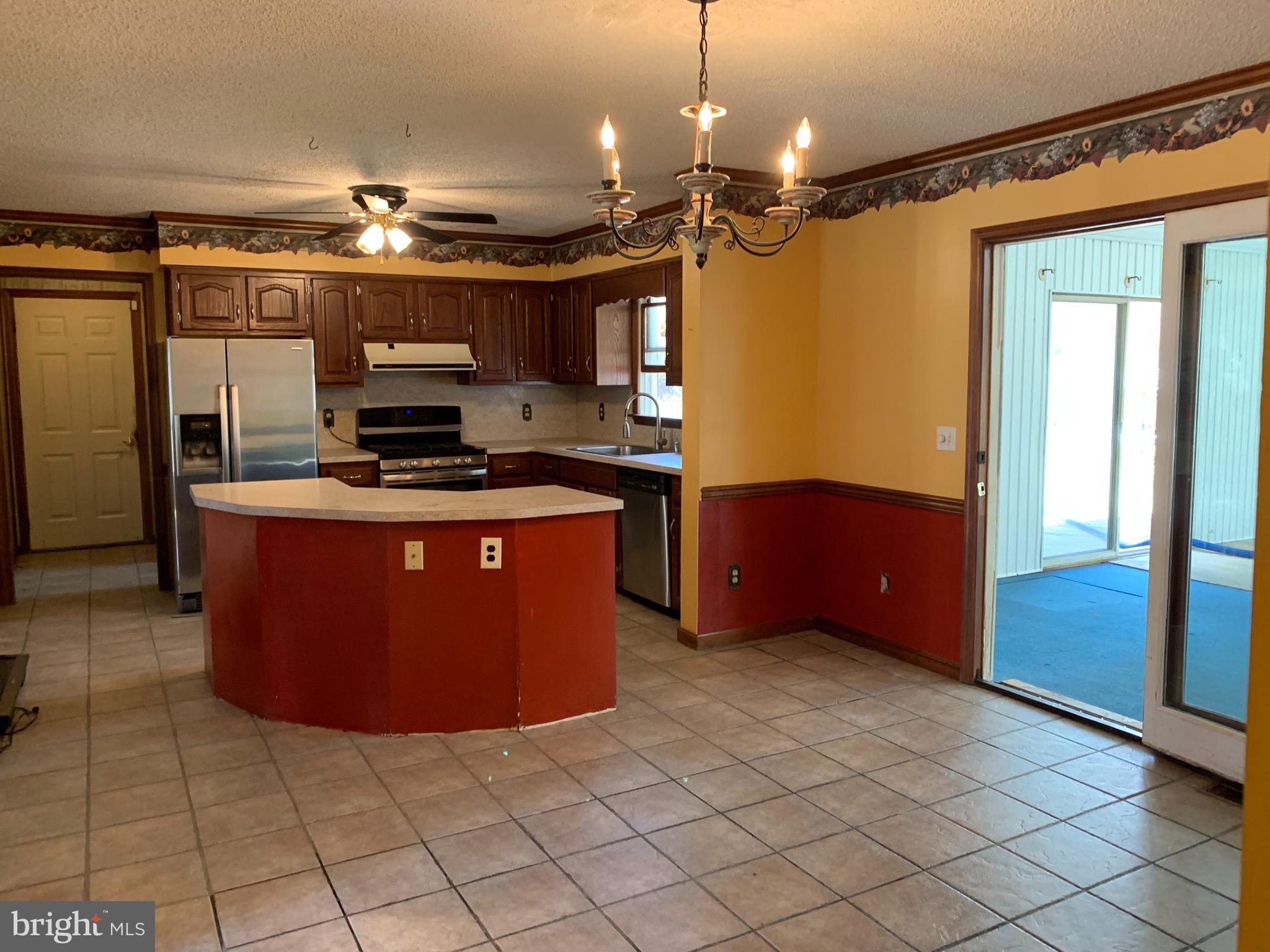 120 Lums Pond Road Bear, DE 19701 - Photo 7 of 28 Kitchen dining area w. access to indoor pool room.