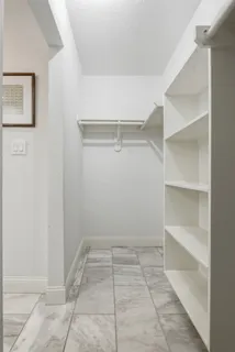 a view of an empty walk in closet