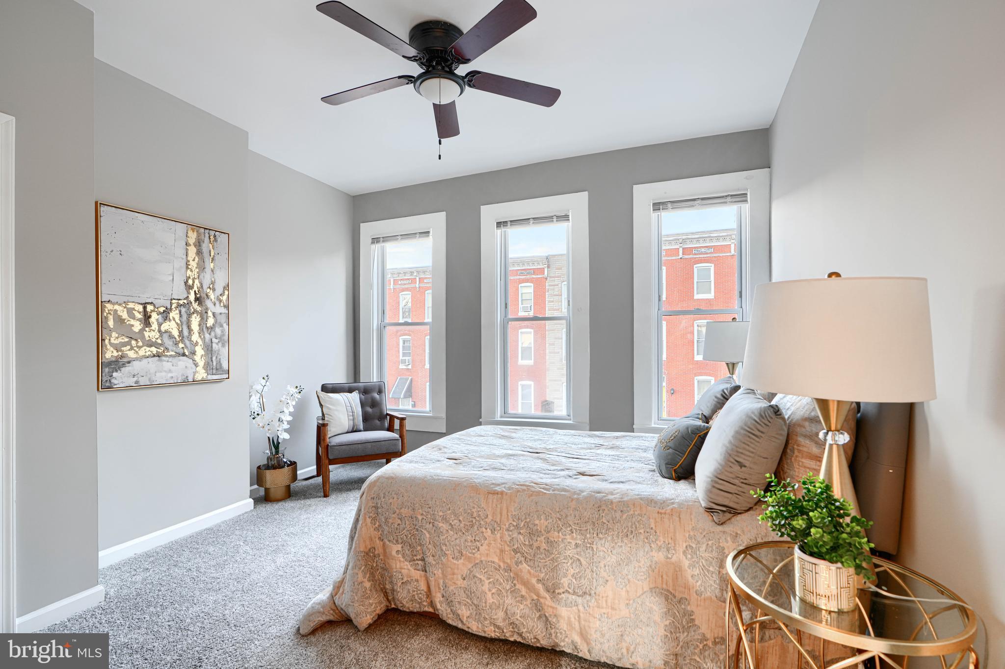 717 East Biddle Street Baltimore, MD 21202 - Photo 25 of 47 a spacious bedroom with a bed and a window