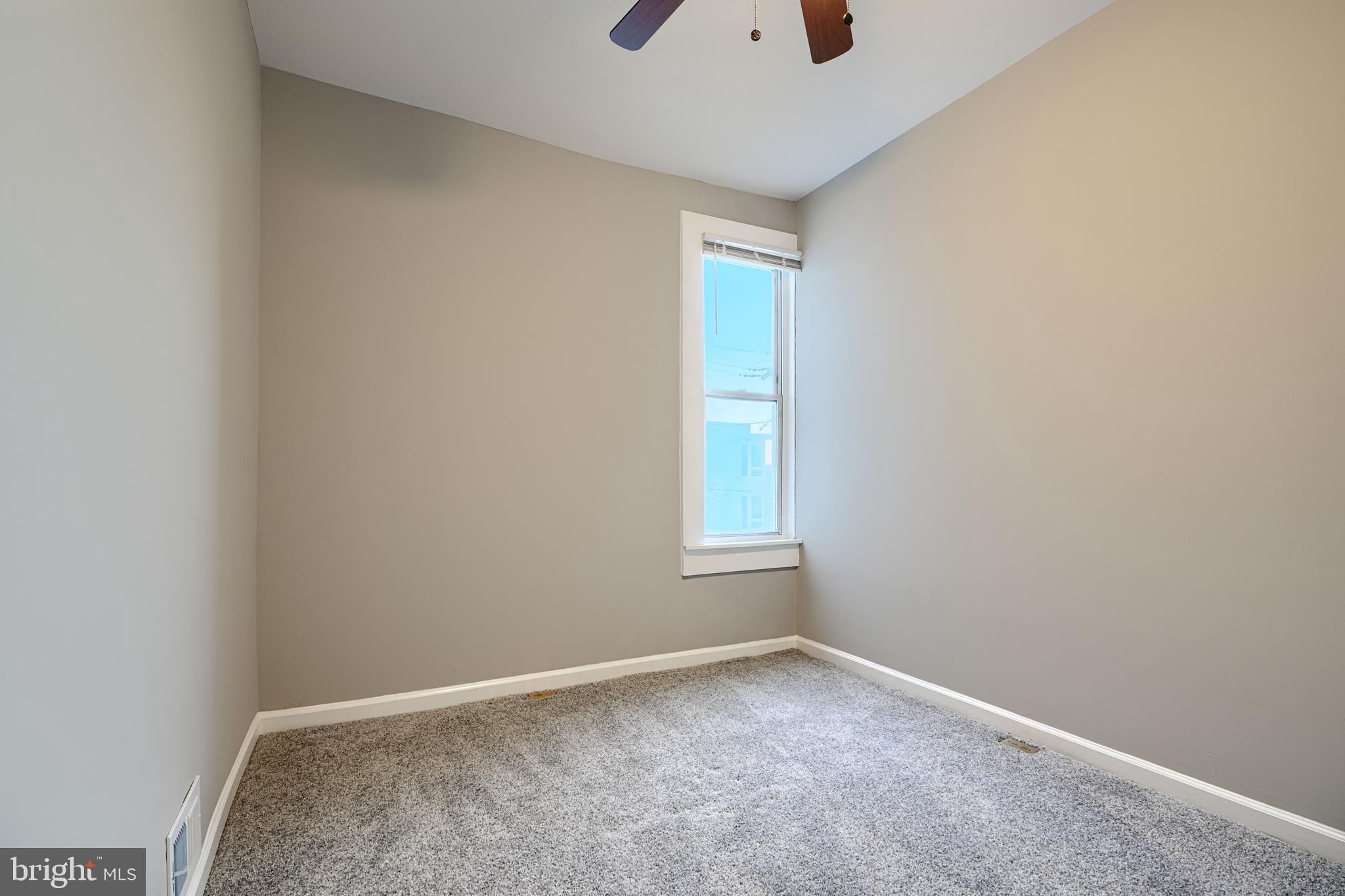 717 East Biddle Street Baltimore, MD 21202 - Photo 28 of 47 an empty room with a window