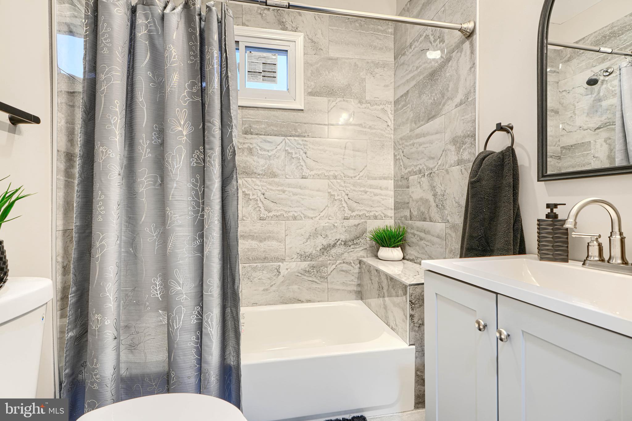 717 East Biddle Street Baltimore, MD 21202 - Photo 35 of 47 a bathroom with a sink toilet and shower
