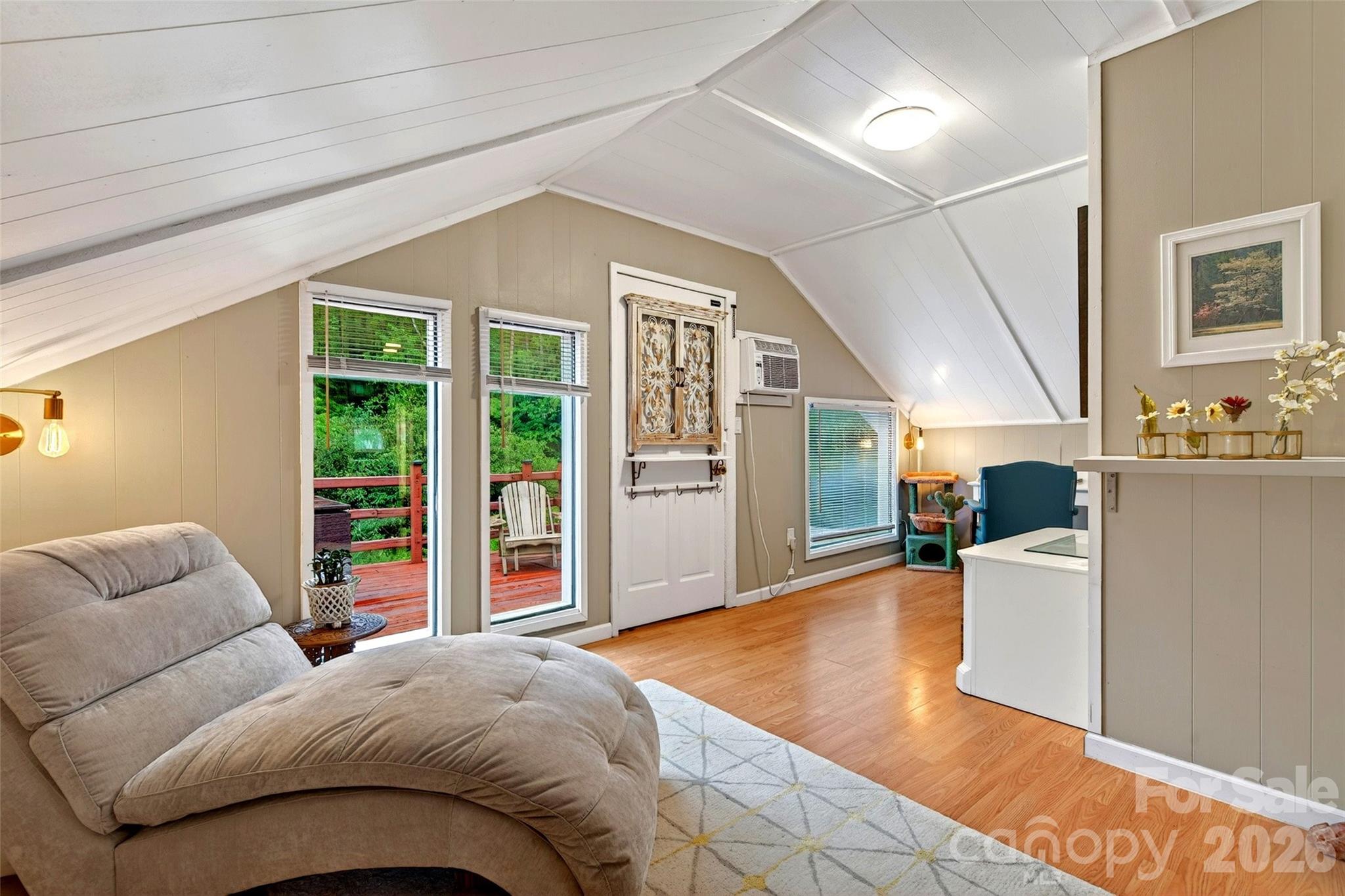227 Locust Cove Road Marion, NC 28752 - Photo 13 of 34 a bedroom with a large bed and a couch