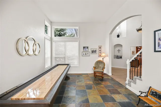 a view of a room with wooden floor and windows