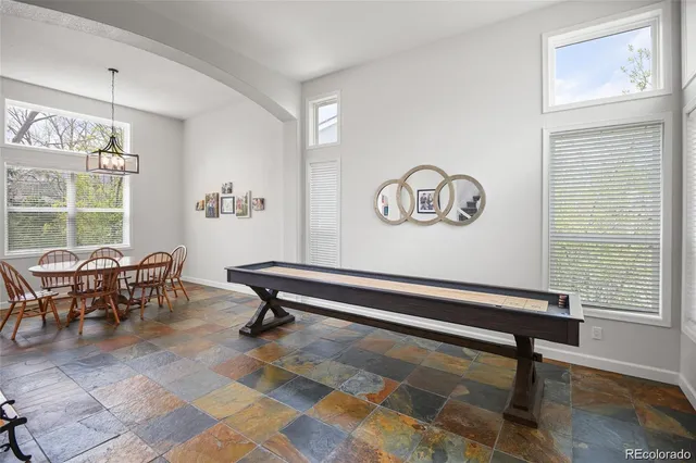 a living room with a table and a window