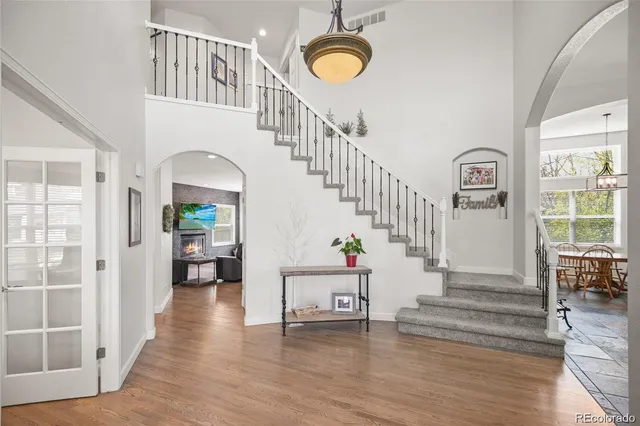 a view of entryway with wooden floor and windows