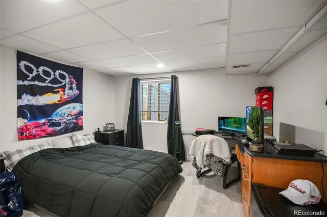 a bedroom with a bed and a couch