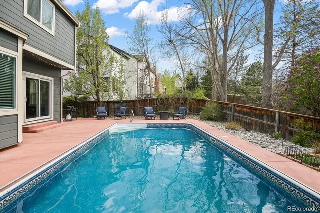 a view of a backyard with a large pool
