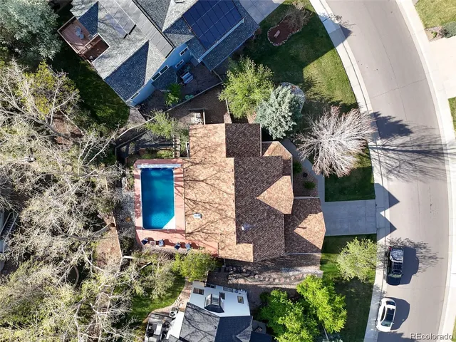 an aerial view of a house with a yard