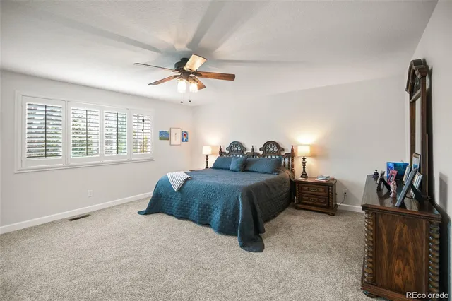 a bedroom with bed and a window