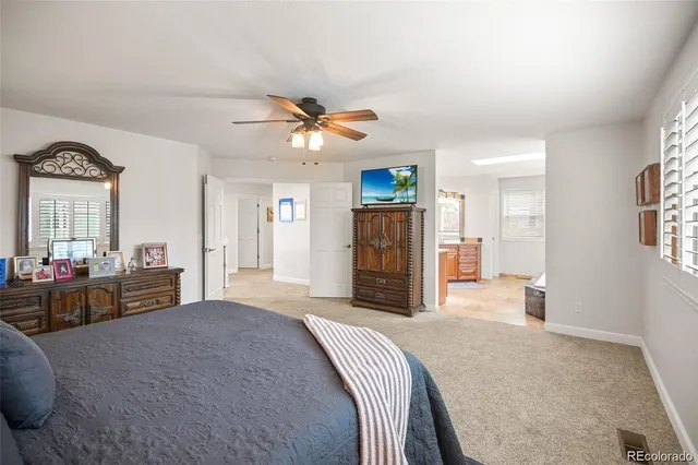 a bedroom with a bed dresser and a window