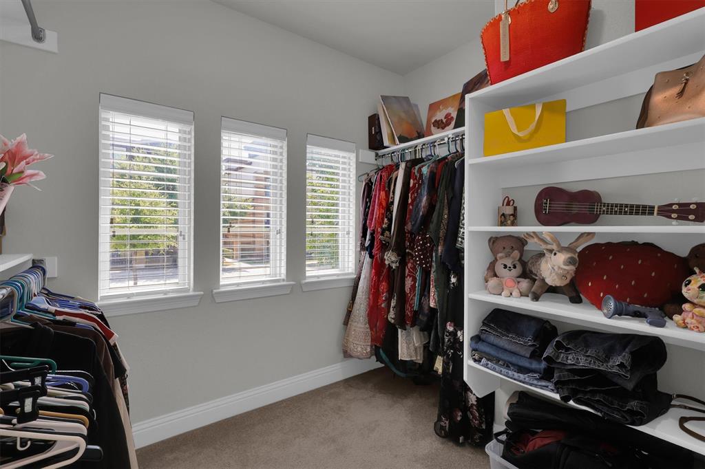 4504 Del Rey Avenue McKinney, TX 75070 - Photo 22 of 40 a view of walk in closet with clothes and shoes