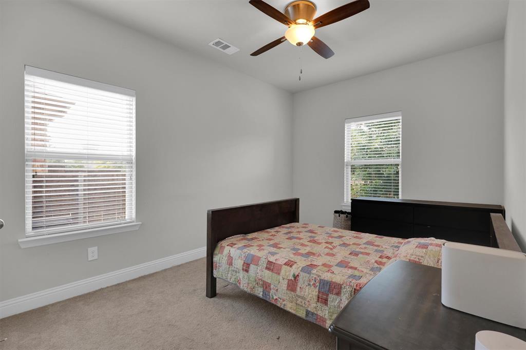 4504 Del Rey Avenue McKinney, TX 75070 - Photo 32 of 40 a bedroom with a large bed and a window