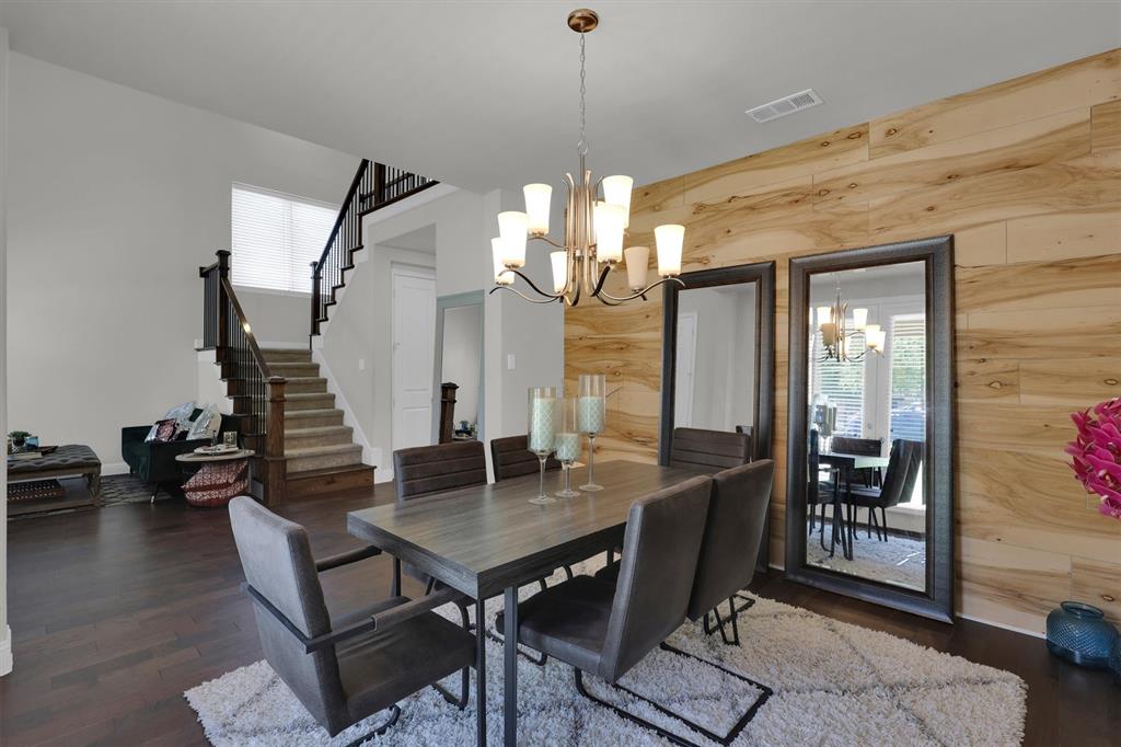 4504 Del Rey Avenue McKinney, TX 75070 - Photo 4 of 40 a view of a dining room with furniture and wooden floor