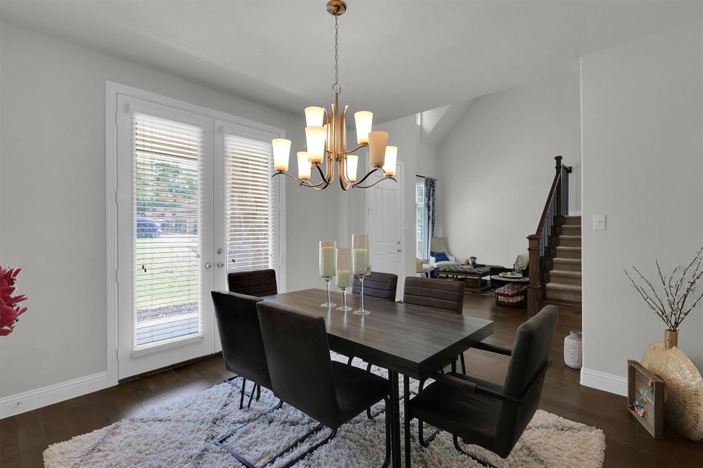 4504 Del Rey Avenue McKinney, TX 75070 - Photo 5 of 40 a view of a dining room with furniture window and wooden floor