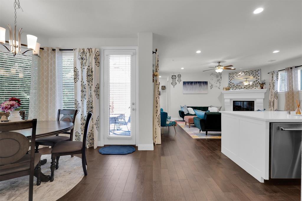 4504 Del Rey Avenue McKinney, TX 75070 - Photo 8 of 40 a living room with furniture a wooden floor and a large window