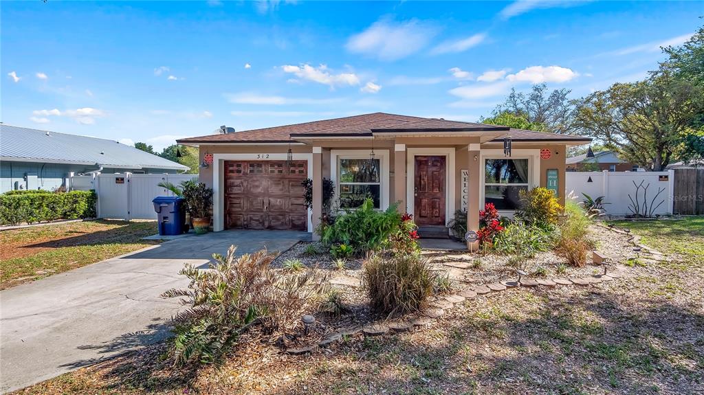 312 Tuscanooga Road Mascotte, FL 34753 - Photo 1 of 1 Front View with Nice Landscaping