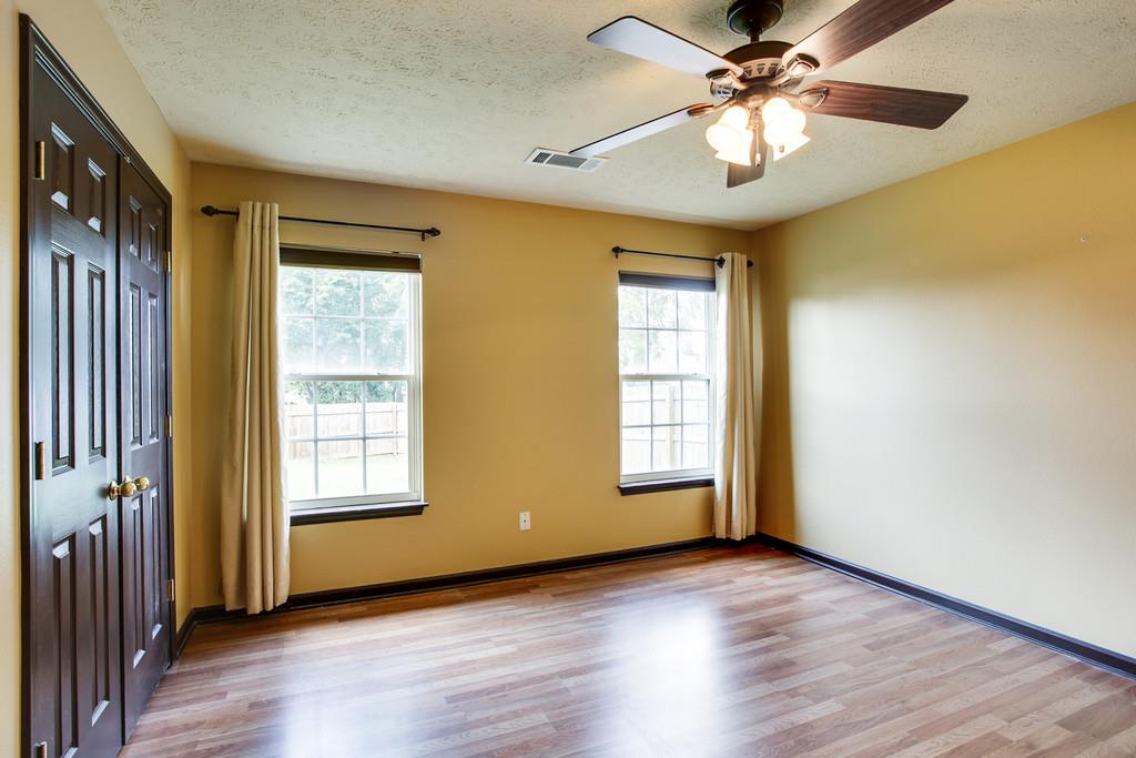 1909 Portway Road Spring Hill, TN 37174 - Photo 17 of 30 a view of an empty room with a window and wooden floor