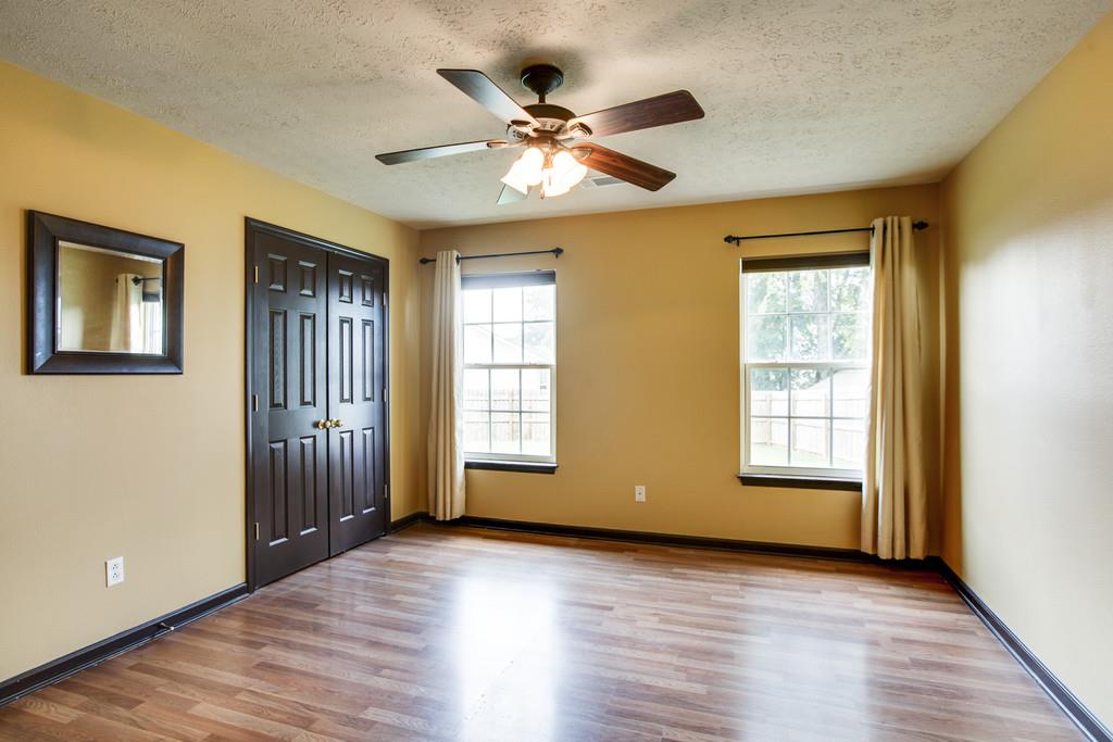 1909 Portway Road Spring Hill, TN 37174 - Photo 18 of 30 a view of an empty room with wooden floor and a window