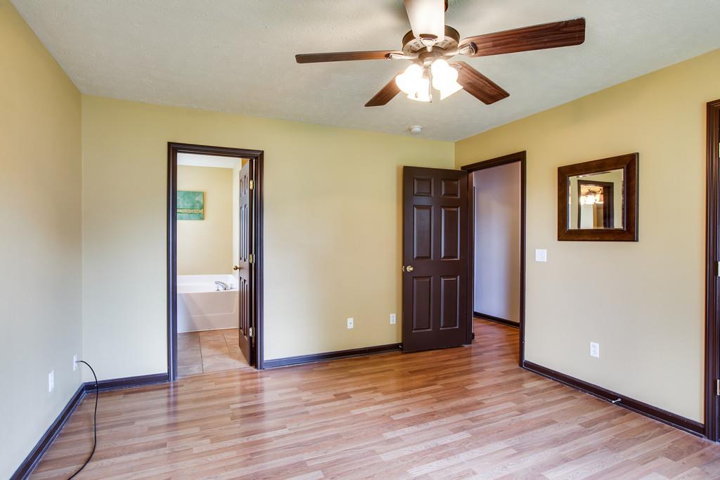 1909 Portway Road Spring Hill, TN 37174 - Photo 19 of 30 a view of an empty room with wooden floor