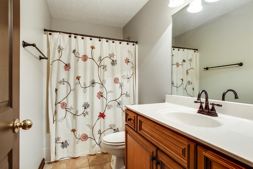 1909 Portway Road Spring Hill, TN 37174 - Photo 23 of 30 a bathroom with a sink and a mirror