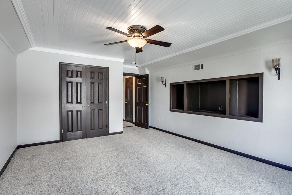 1909 Portway Road Spring Hill, TN 37174 - Photo 26 of 30 a view of a livingroom with a ceiling fan and staircase