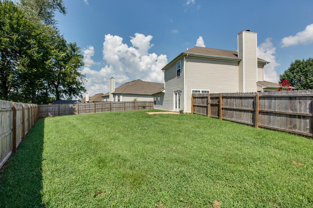 1909 Portway Road Spring Hill, TN 37174 - Photo 30 of 30 a view of a backyard with a garden and entertaining space