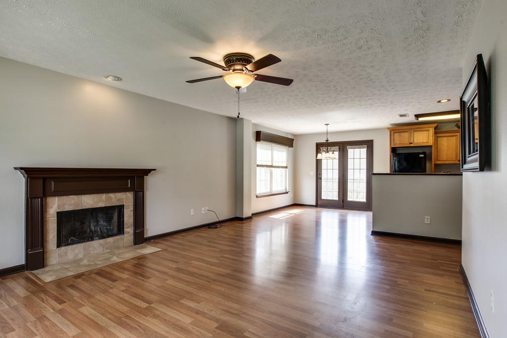 1909 Portway Road Spring Hill, TN 37174 - Photo 5 of 30 a view of an empty room with a fireplace and a window