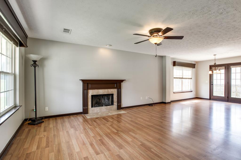 1909 Portway Road Spring Hill, TN 37174 - Photo 6 of 30 a view of an empty room with a window and wooden floor