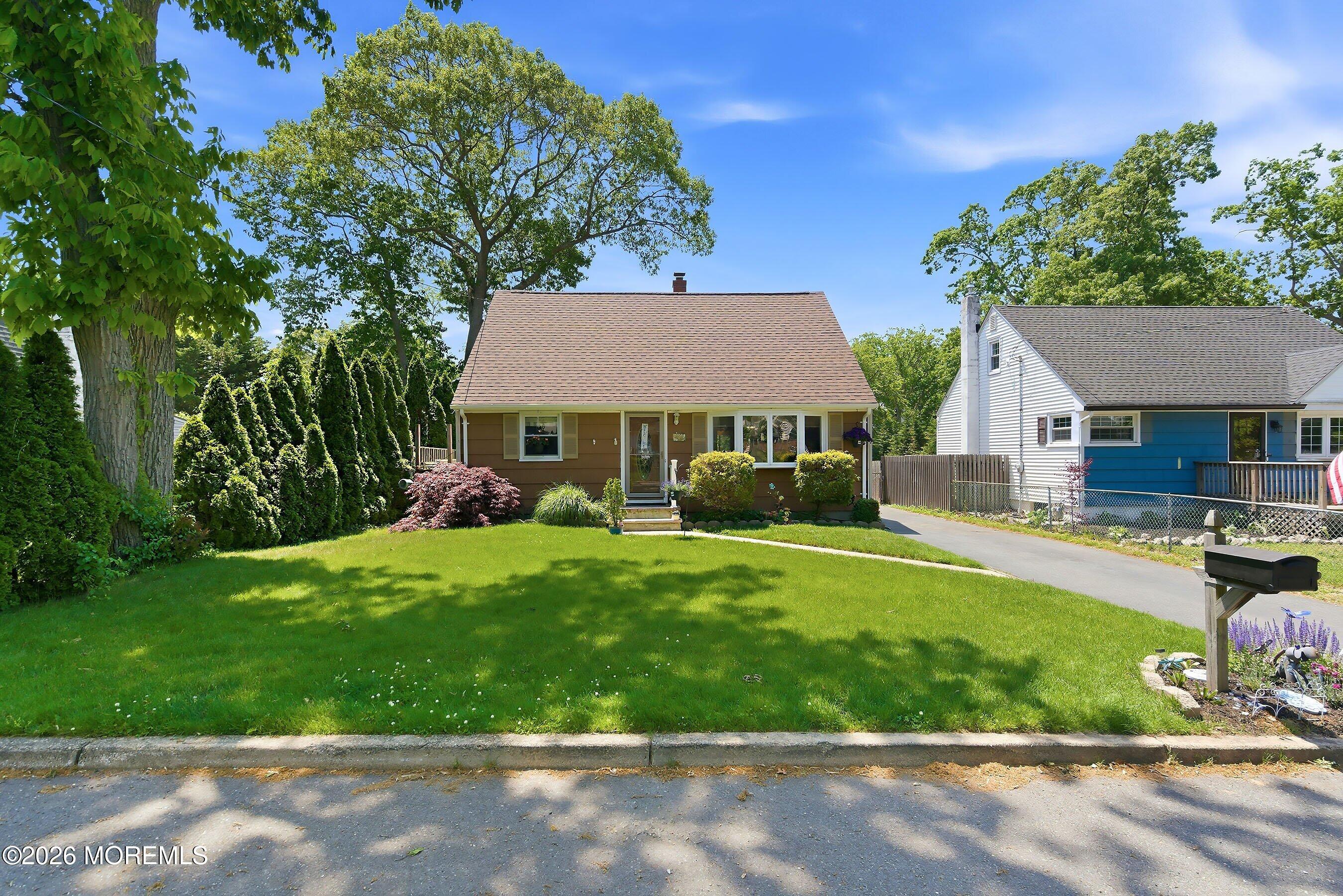 412 Moore Road Neptune Township, NJ 07753 - Photo 1 of 36 a view of house with backyard and outdoor seating