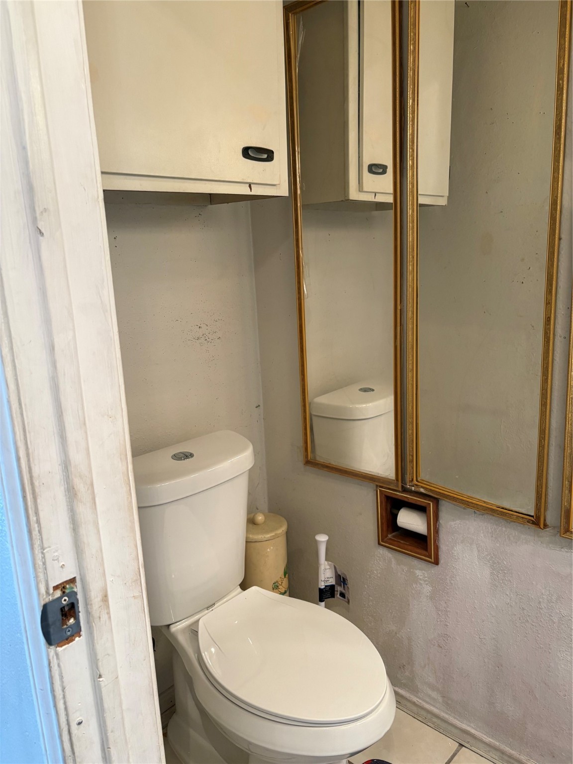 2131 Campbell Road Houston, TX 77080 - Photo 16 of 39 a white toilet sitting next to a bathroom sink