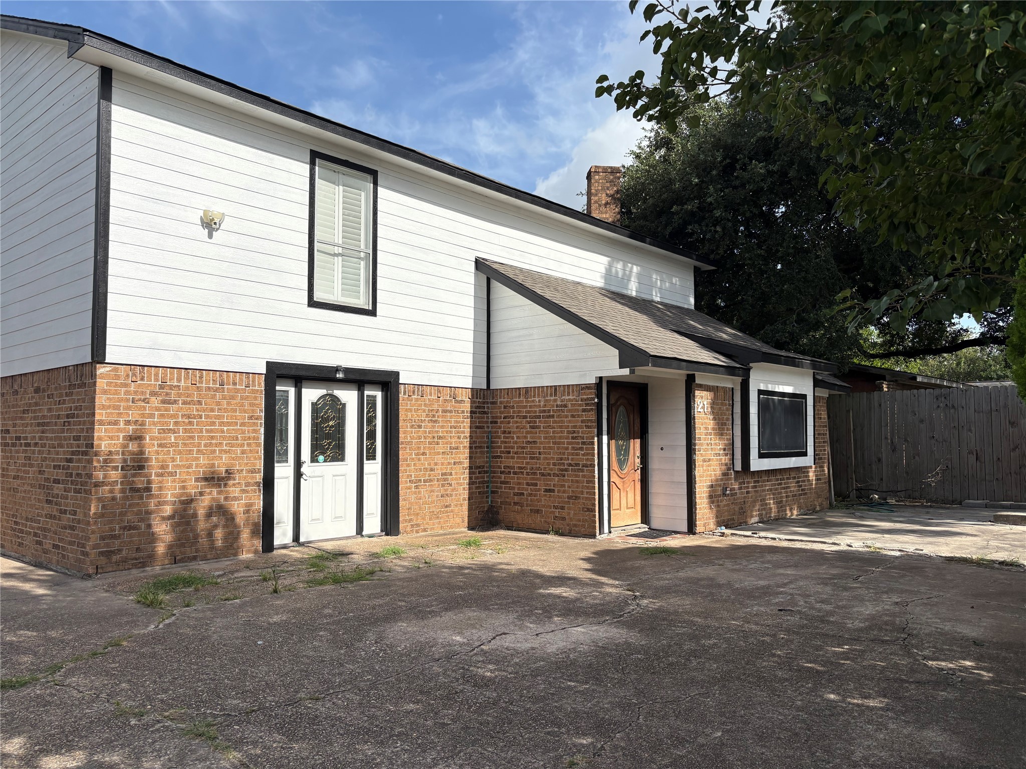2131 Campbell Road Houston, TX 77080 - Photo 30 of 39 a view of a house with a yard and garage