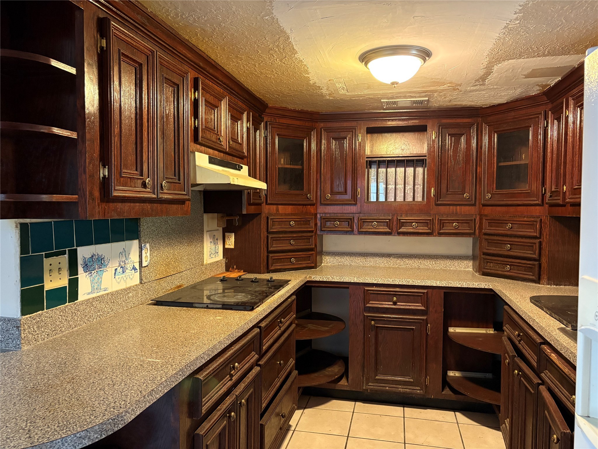 2131 Campbell Road Houston, TX 77080 - Photo 9 of 39 a kitchen with a stove a sink and cabinets