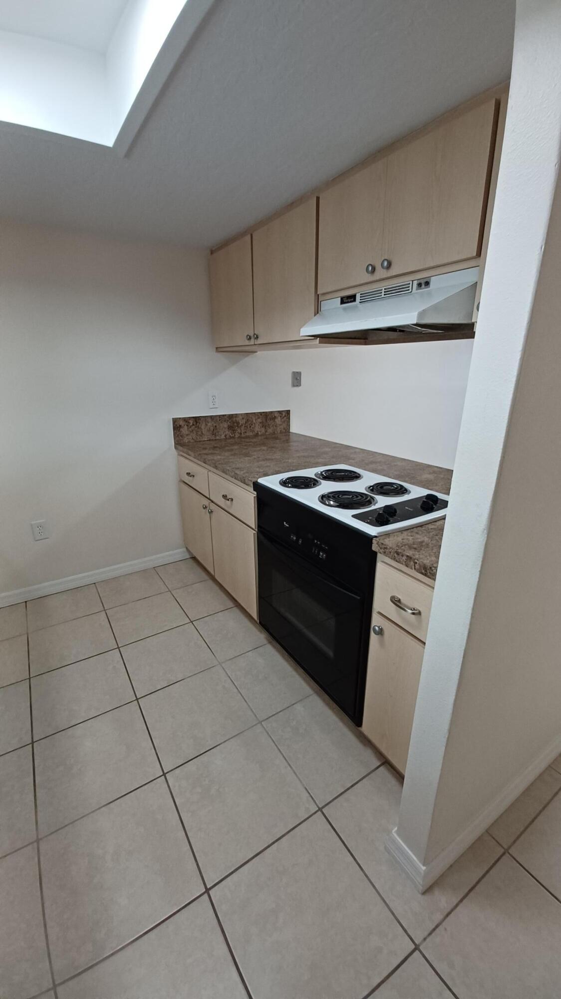 280 Ulster Lane Melbourne, FL 32935 - Photo 6 of 34 a kitchen with granite countertop a stove a sink and dishwasher