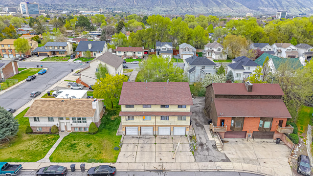 630 1100 West Provo, UT 84601 - Photo 64 of 64 Multi-unit property featuring a brown shingle roof and three garage doors