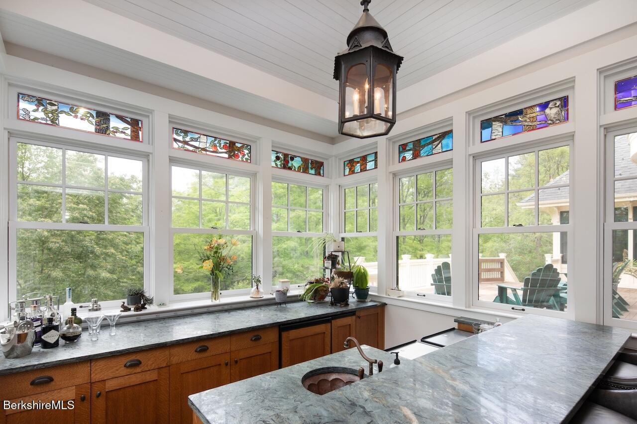 50 E Road Alford, MA 01266 - Photo 12 of 60 a very nice looking room with a large window and chandelier