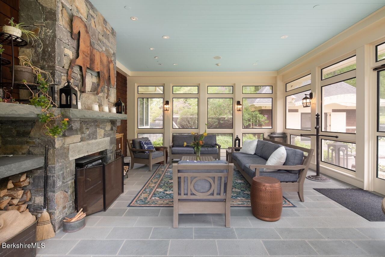 50 E Road Alford, MA 01266 - Photo 14 of 60 a living room with furniture a large window and a fireplace