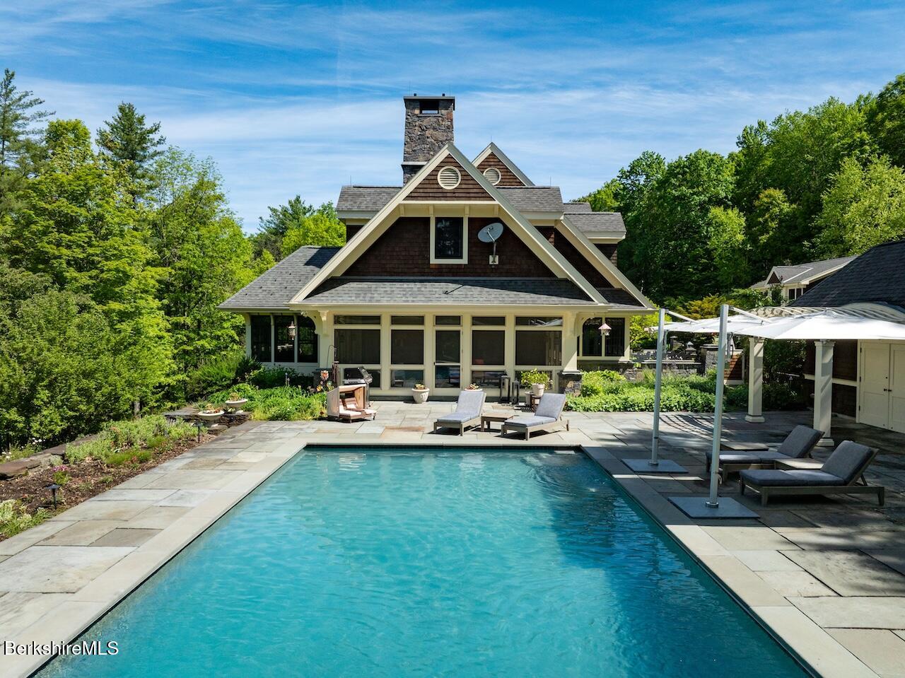 50 E Road Alford, MA 01266 - Photo 17 of 60 a front view of a house with swimming pool having outdoor seating