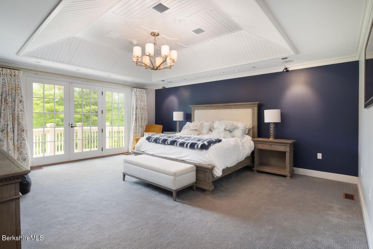 50 E Road Alford, MA 01266 - Photo 29 of 60 a spacious bedroom with a bed and a large window
