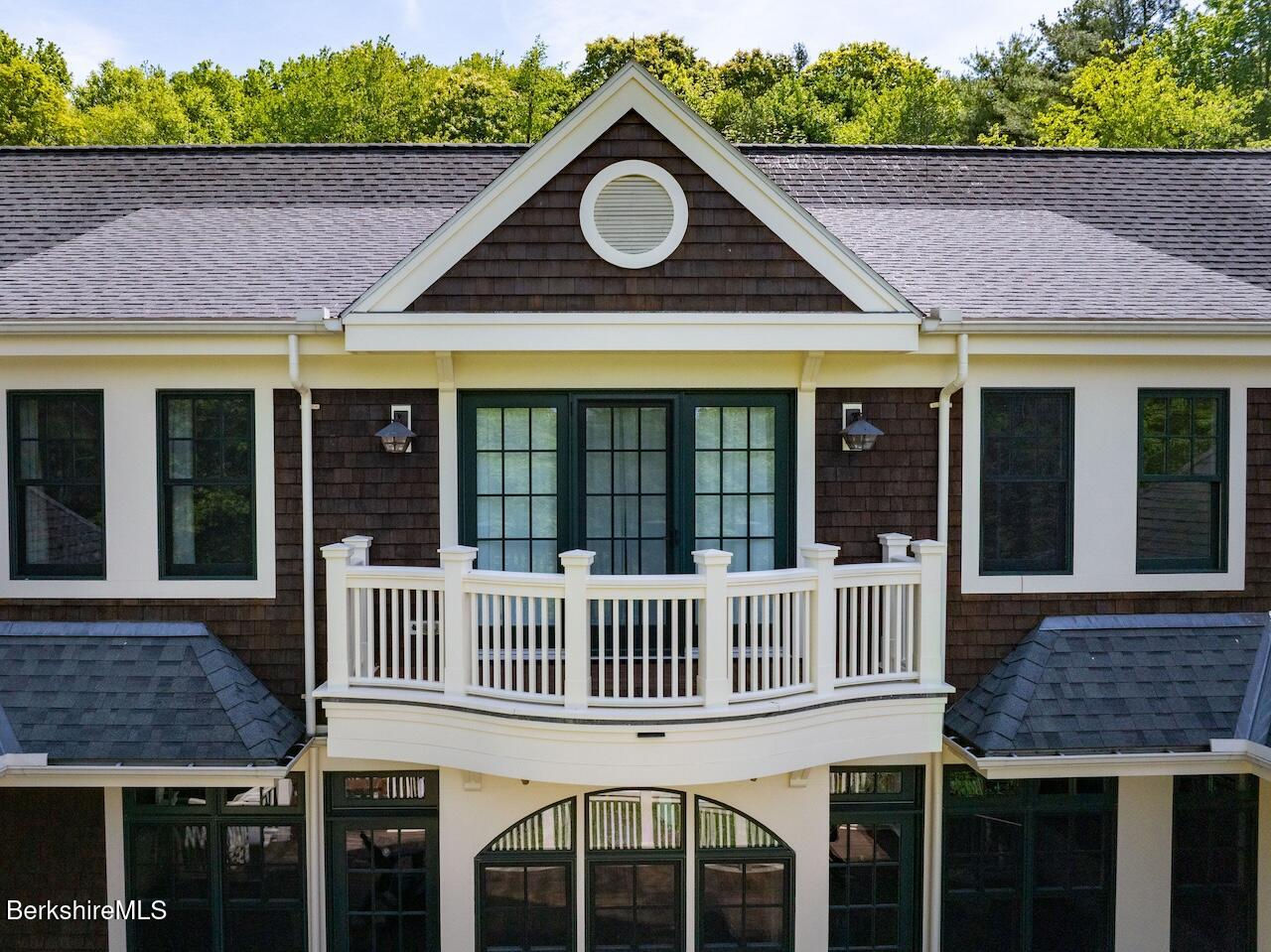 50 E Road Alford, MA 01266 - Photo 30 of 60 a view of a house with a small deck and a garden