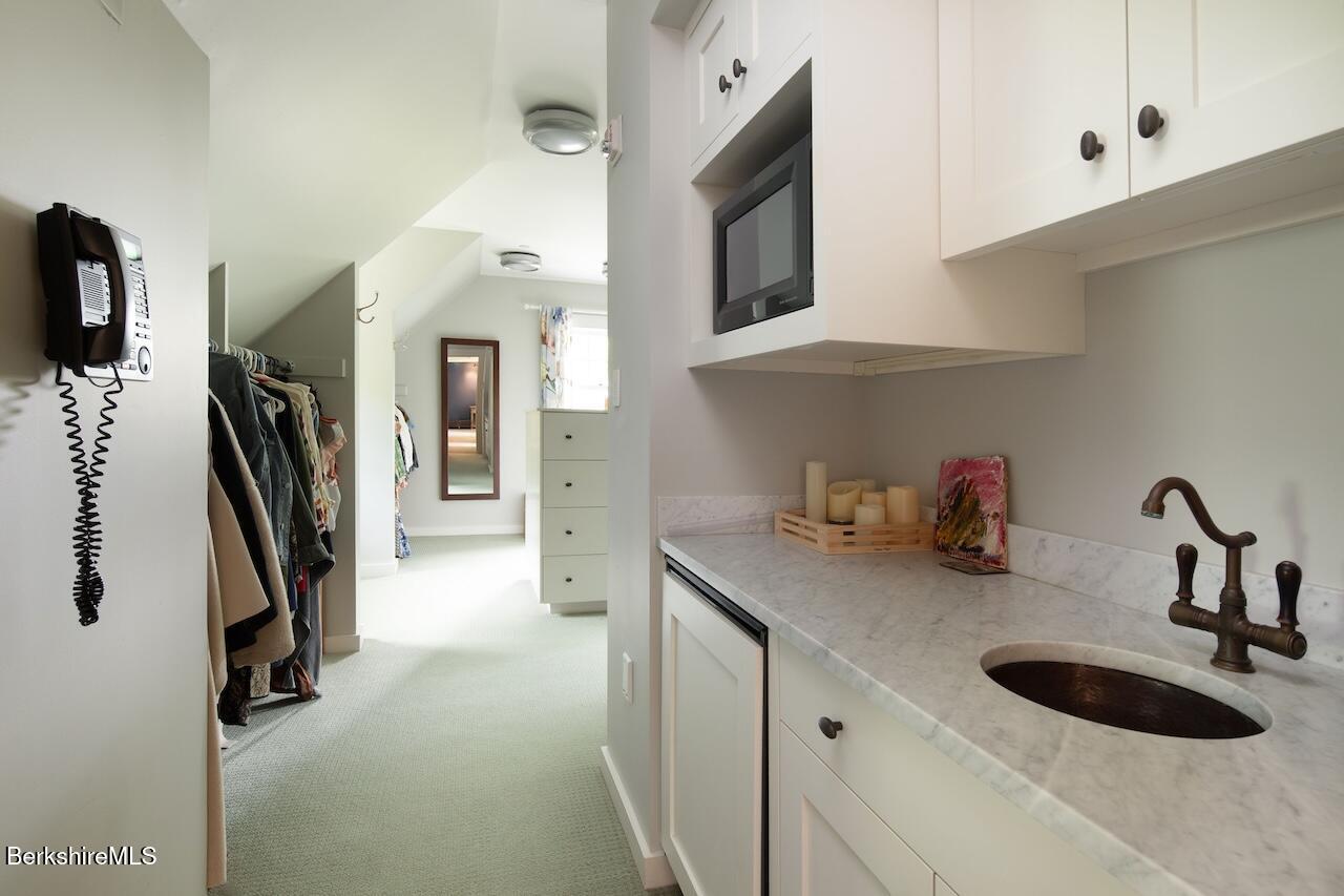 50 E Road Alford, MA 01266 - Photo 35 of 60 a kitchen with a sink and a stove top oven