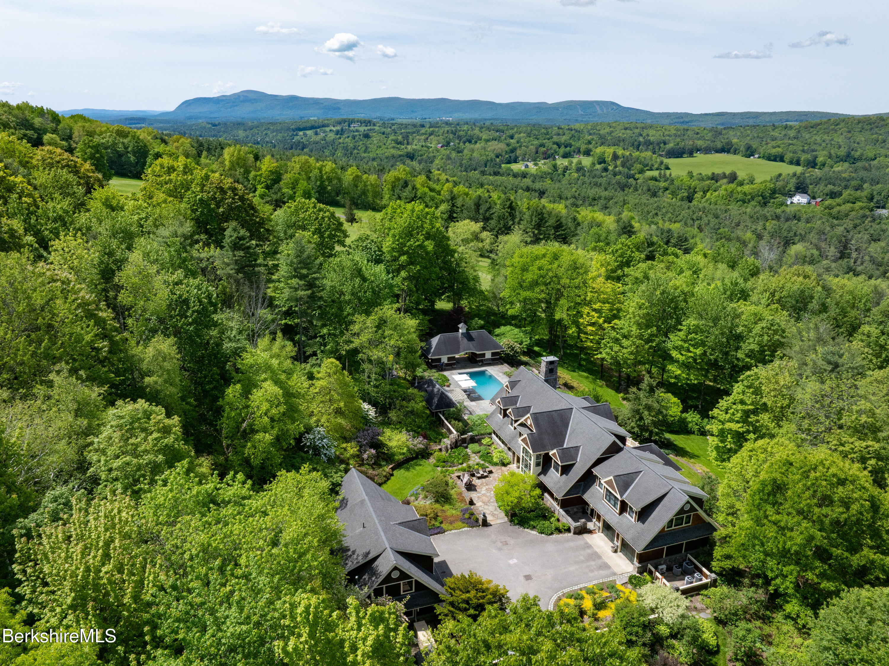 50 E Road Alford, MA 01266 - Photo 6 of 60 an aerial view of green landscape with trees houses and mountain view