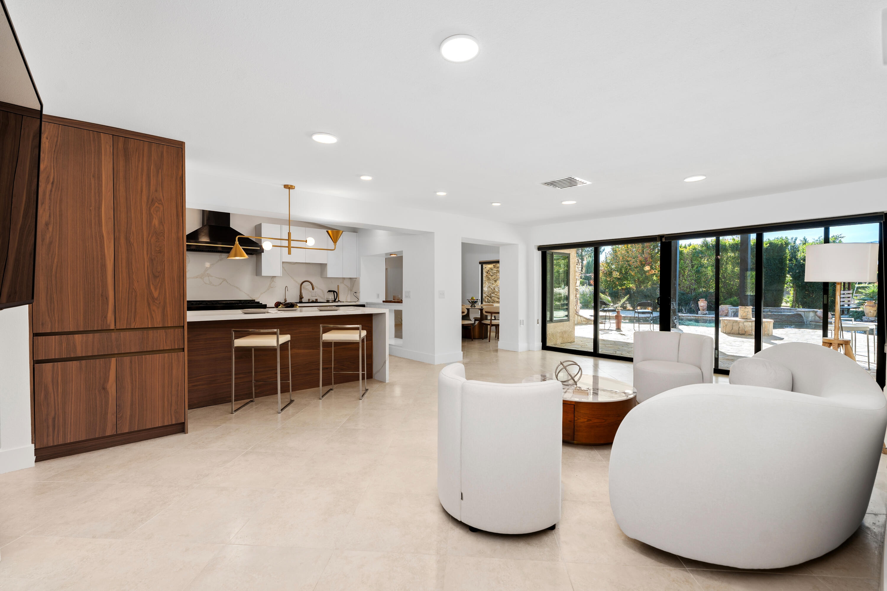 72114 Follansbee Road Rancho Mirage, CA 92270 - Photo 21 of 58 a living room with stainless steel appliances furniture and a kitchen view