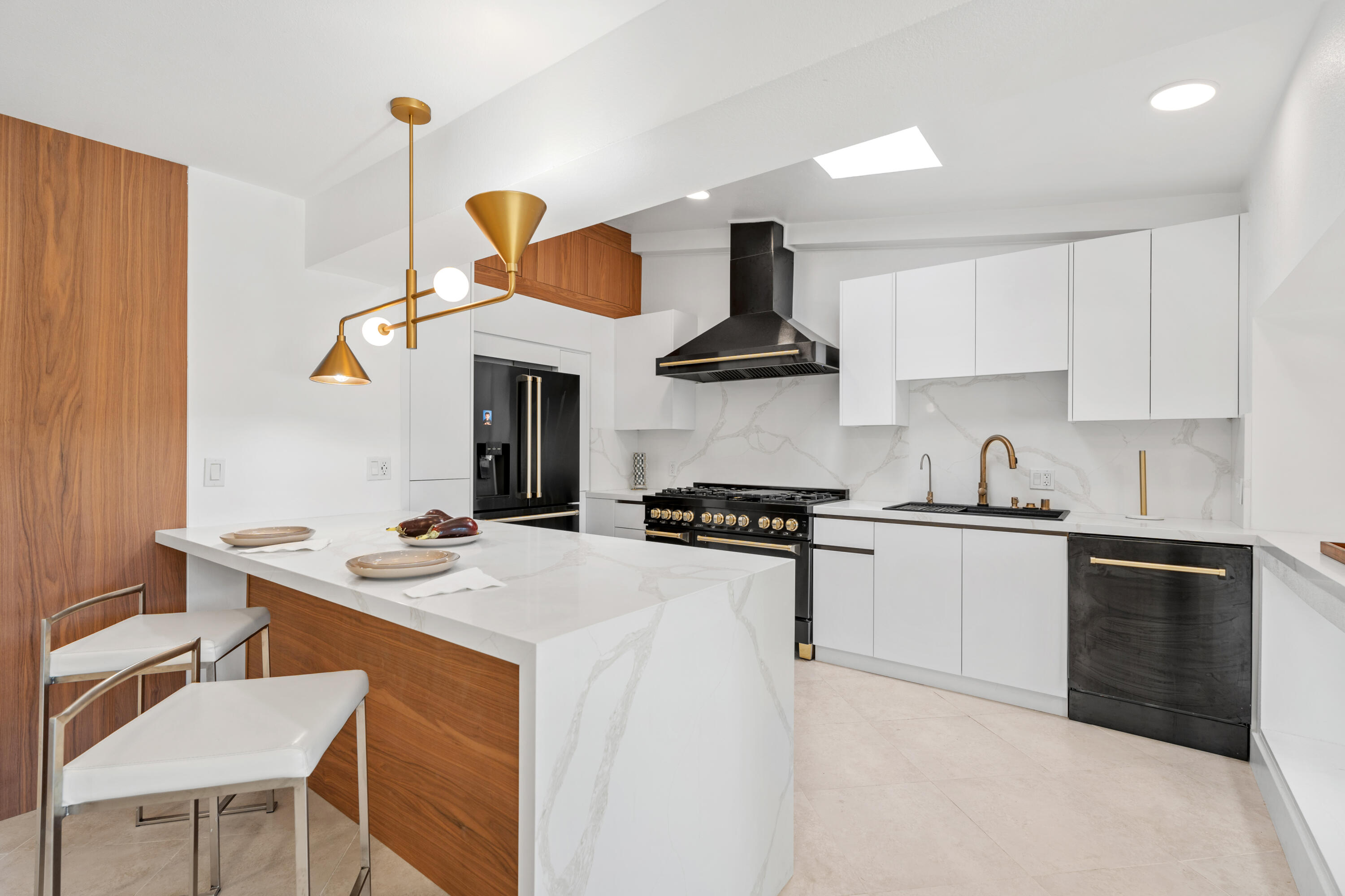 72114 Follansbee Road Rancho Mirage, CA 92270 - Photo 22 of 58 a kitchen with a sink a stove and chairs