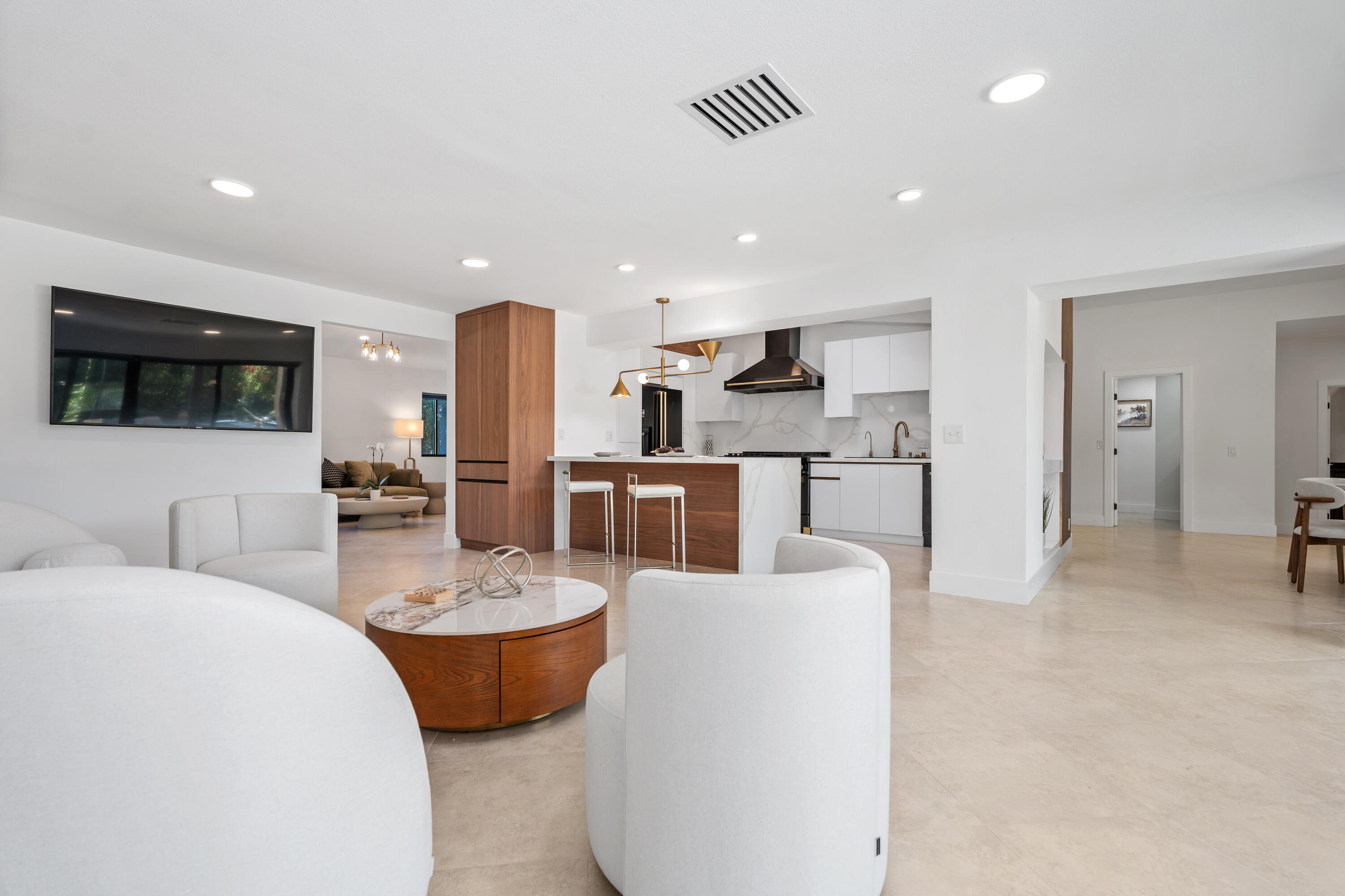 72114 Follansbee Road Rancho Mirage, CA 92270 - Photo 23 of 58 a living room with stainless steel appliances kitchen island granite countertop furniture and a view of kitchen