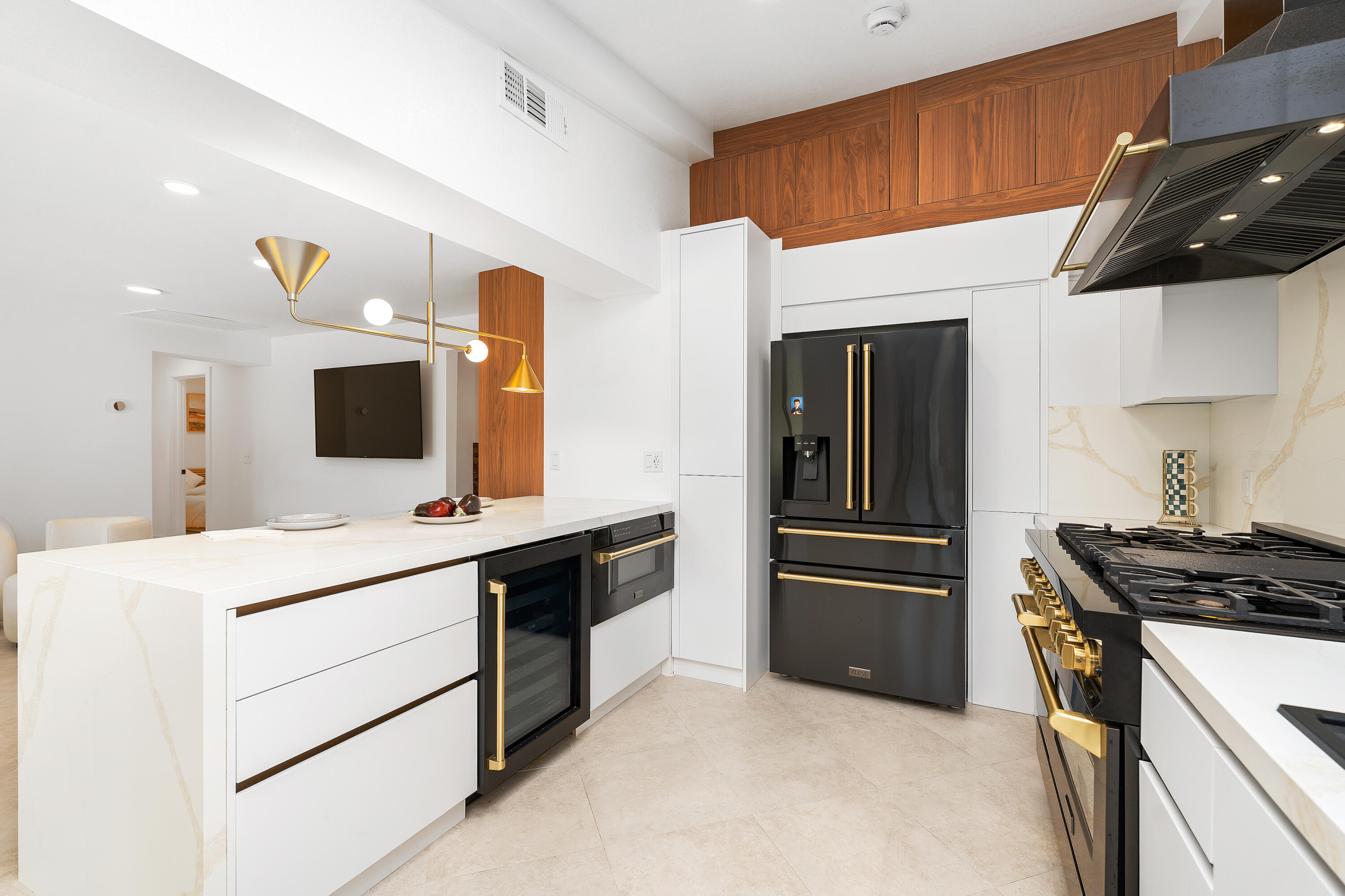 72114 Follansbee Road Rancho Mirage, CA 92270 - Photo 26 of 58 a kitchen with stainless steel appliances a stove microwave and refrigerator
