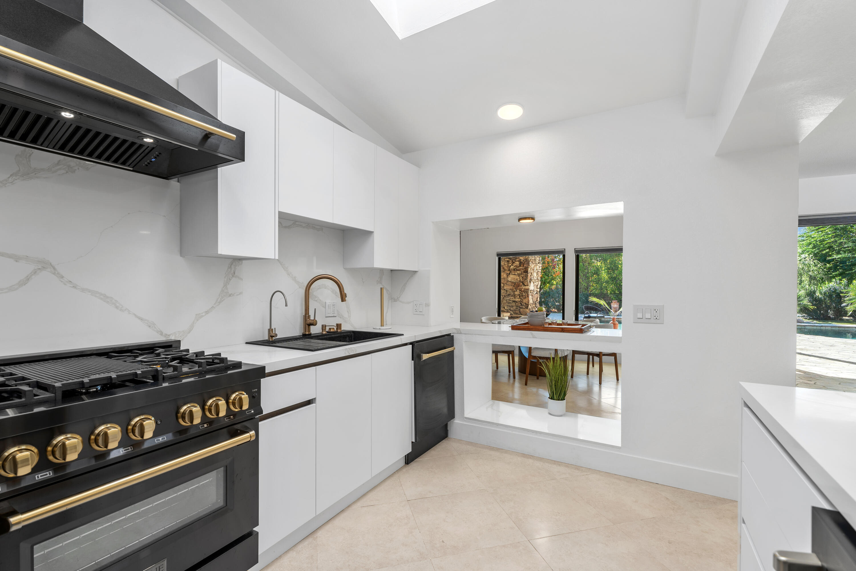 72114 Follansbee Road Rancho Mirage, CA 92270 - Photo 27 of 58 a kitchen with a stove and a sink