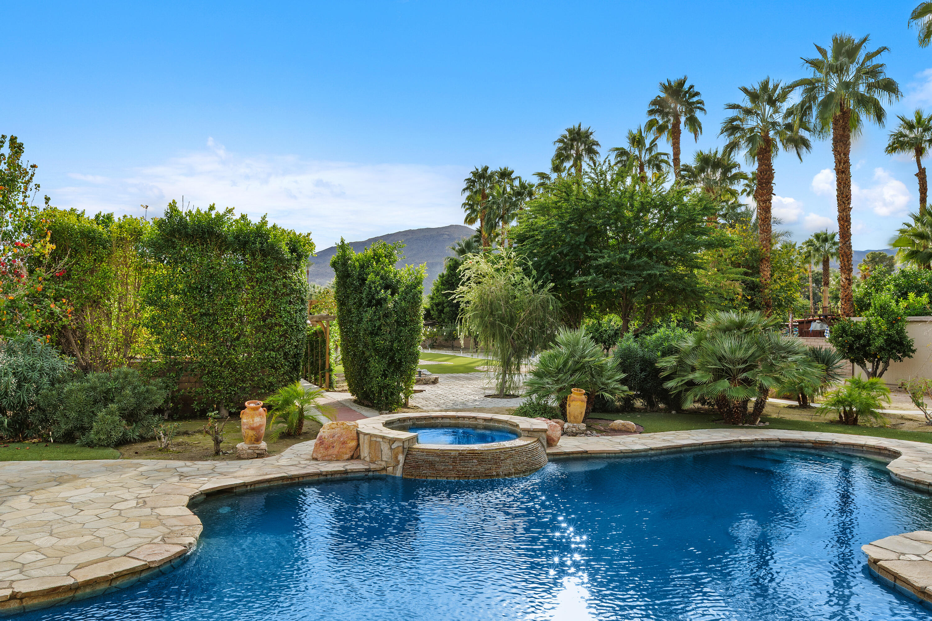 72114 Follansbee Road Rancho Mirage, CA 92270 - Photo 3 of 58 a view of a swimming pool with a patio