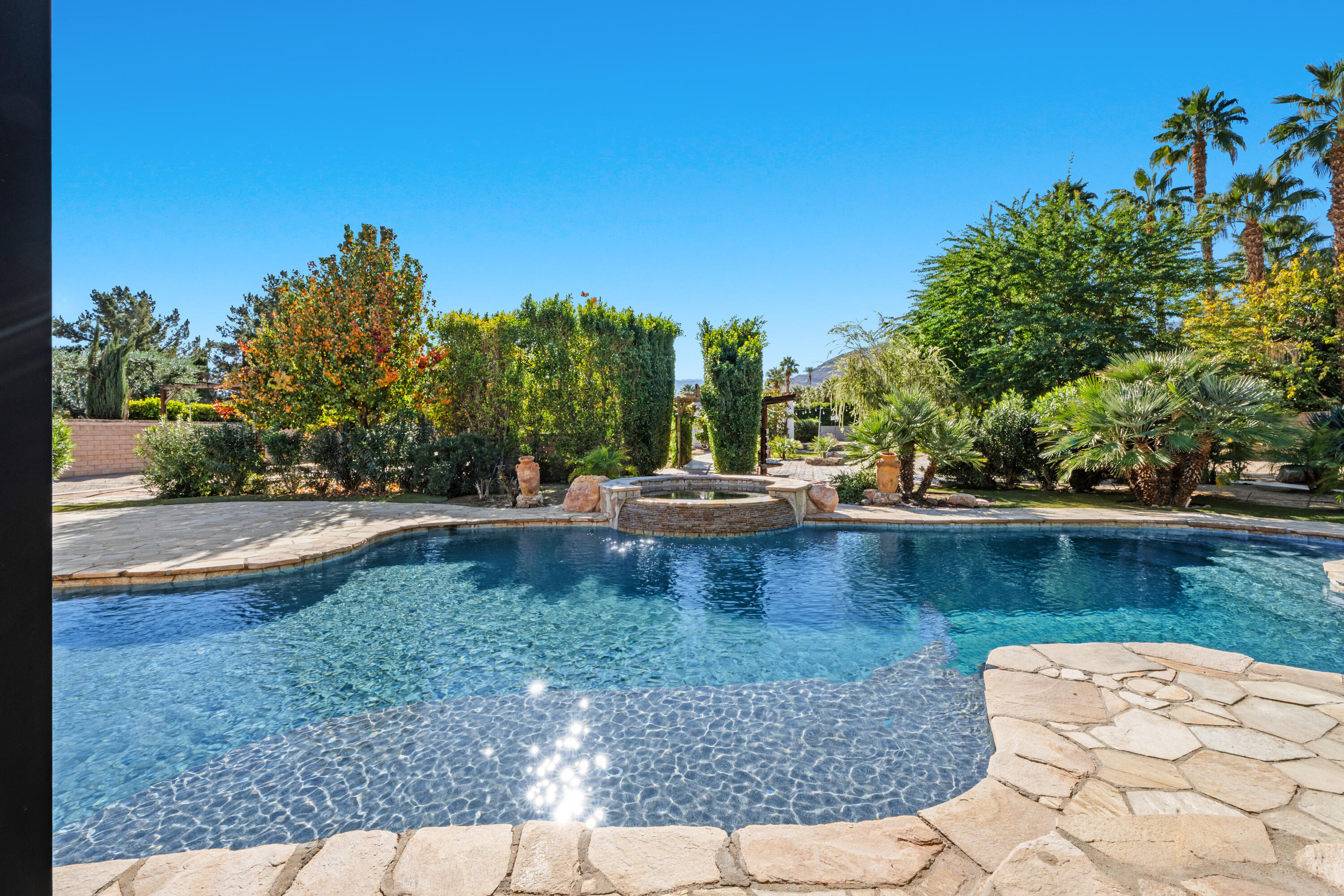 72114 Follansbee Road Rancho Mirage, CA 92270 - Photo 34 of 58 a view of a swimming pool with a patio
